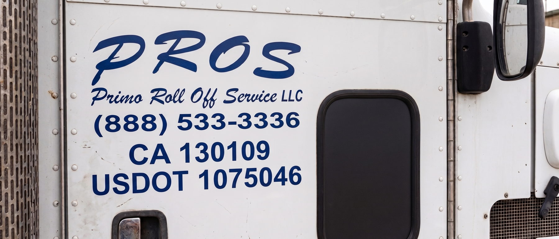 Peterbilt roll-off truck lettered PROS — Primo Roll Off Service LLC